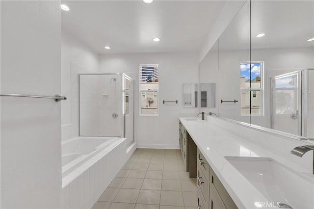 bathroom featuring vanity, independent shower and bath, and tile patterned flooring