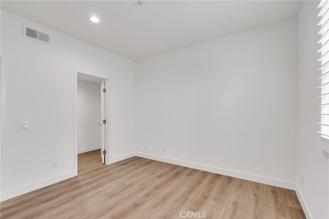 spare room with light wood-type flooring