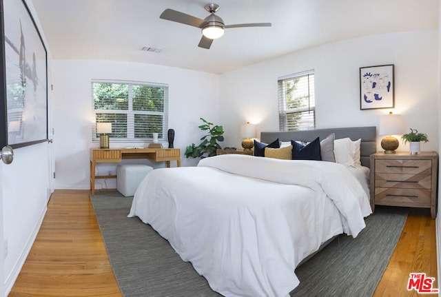 bedroom featuring ceiling fan and wood-type flooring