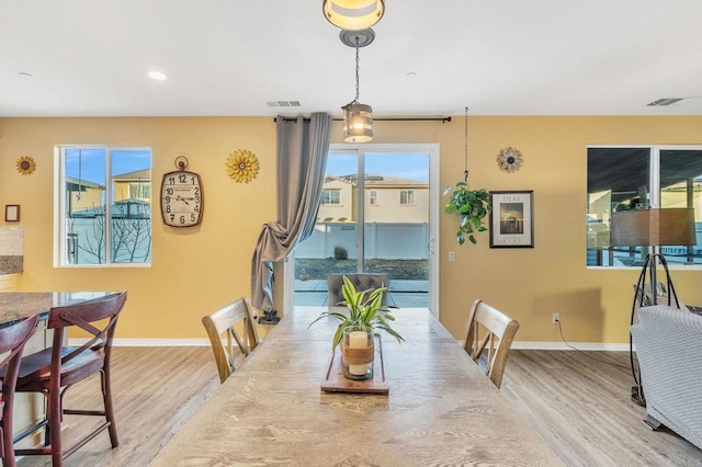 dining area featuring light wood-type flooring