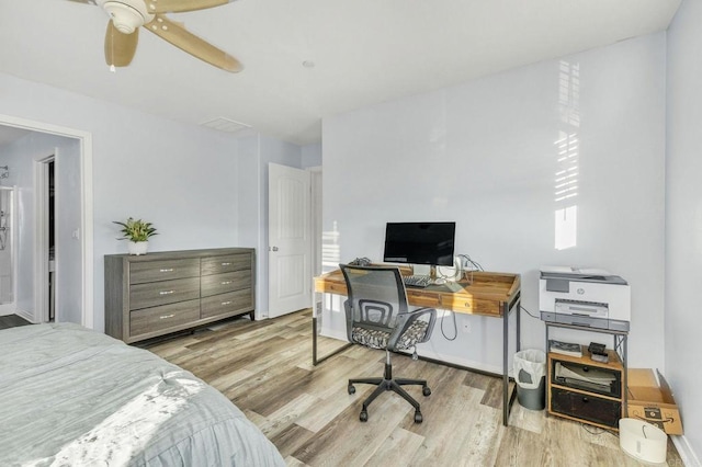 bedroom with ceiling fan and light hardwood / wood-style floors