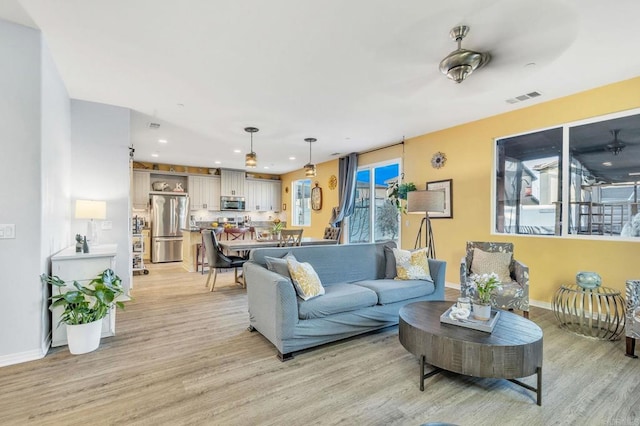 living room with light hardwood / wood-style flooring