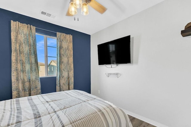 bedroom featuring ceiling fan and wood-type flooring