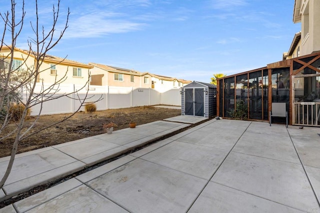 view of patio featuring a storage unit