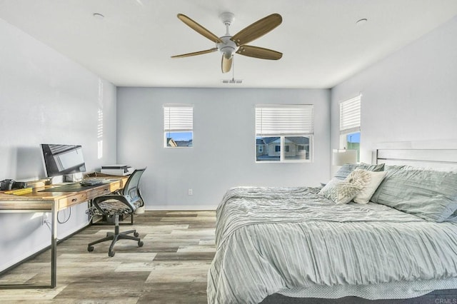 bedroom featuring ceiling fan and light hardwood / wood-style flooring