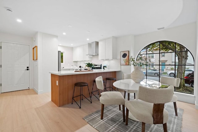 dining room featuring light hardwood / wood-style flooring