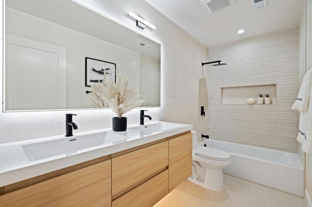 full bathroom featuring vanity, toilet, and tiled shower / bath combo