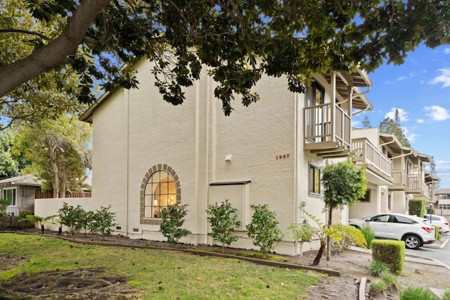 view of home's exterior with a lawn