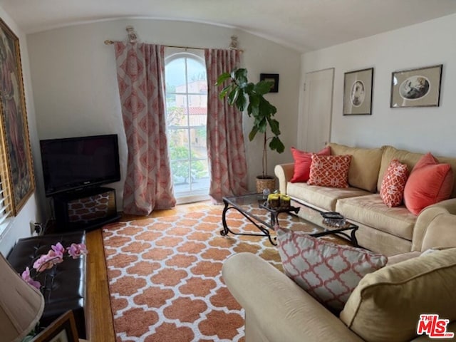 living room with vaulted ceiling