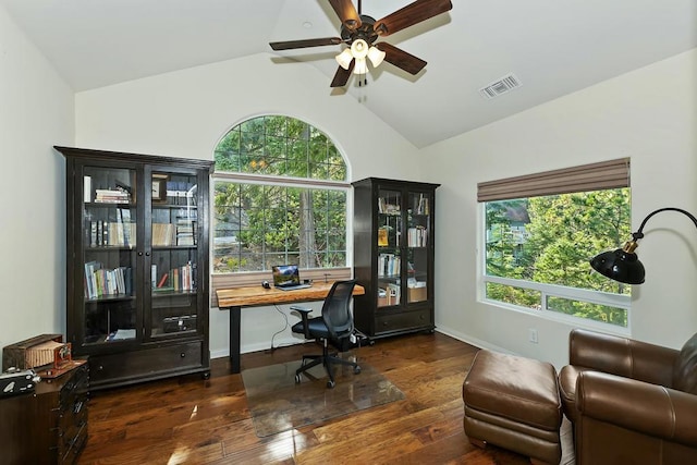 home office with dark hardwood / wood-style flooring, lofted ceiling, and a healthy amount of sunlight