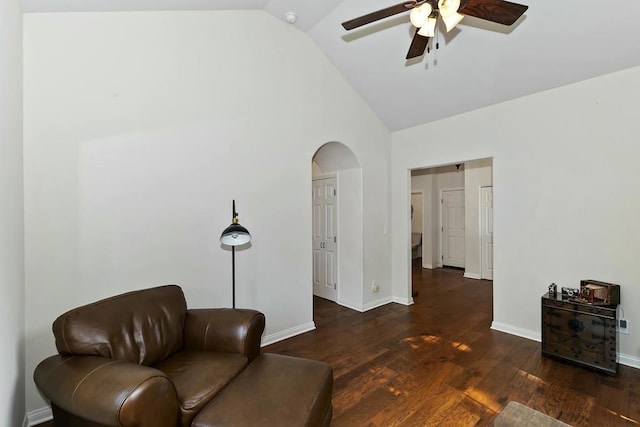 living area featuring ceiling fan, high vaulted ceiling, and dark hardwood / wood-style flooring