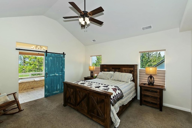 carpeted bedroom with ceiling fan, a barn door, high vaulted ceiling, and multiple windows