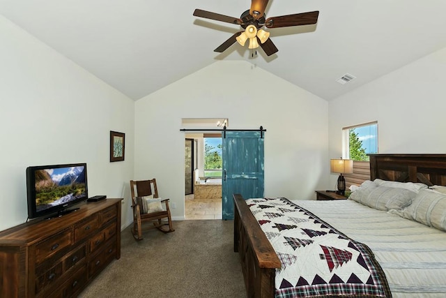 carpeted bedroom with ceiling fan, lofted ceiling, and a barn door