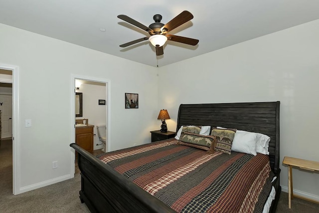 bedroom featuring dark carpet, ensuite bath, and ceiling fan