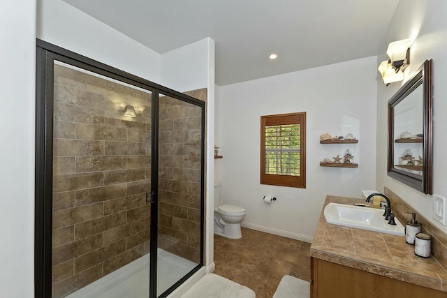 bathroom featuring vanity, walk in shower, and toilet