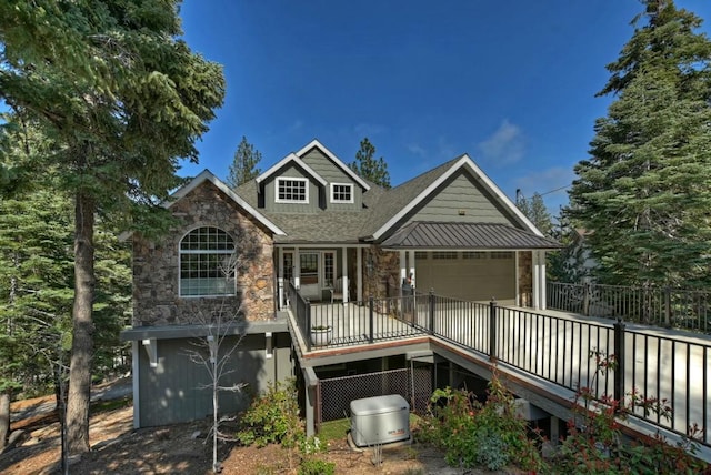 rear view of house featuring a garage