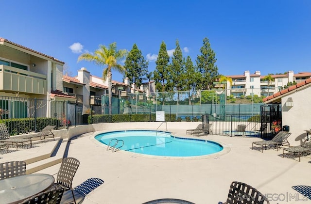 view of pool featuring a patio