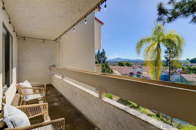 balcony featuring a mountain view