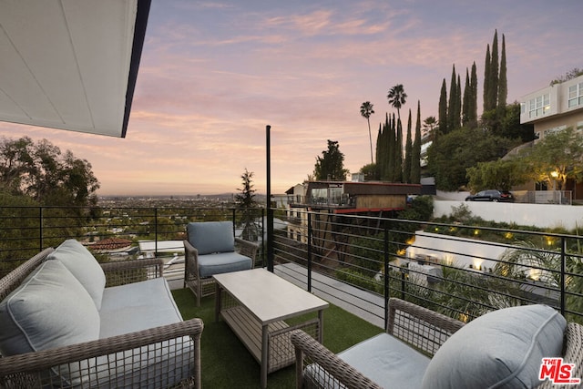 balcony at dusk featuring outdoor lounge area