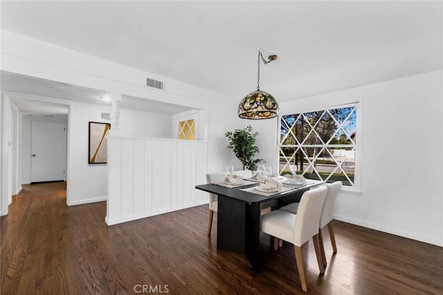 dining space with dark hardwood / wood-style floors