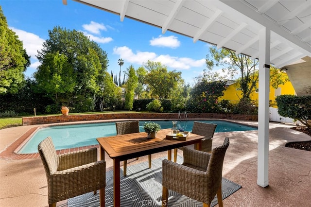 view of pool featuring a patio area