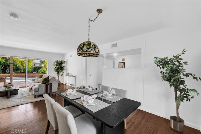 dining space featuring dark hardwood / wood-style flooring