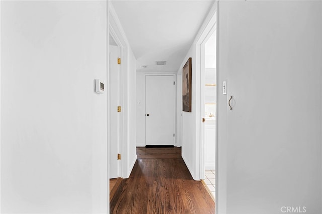 hall featuring dark wood-type flooring