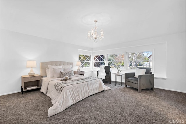 carpeted bedroom featuring a notable chandelier