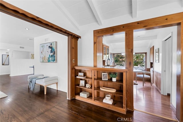 hallway with vaulted ceiling with beams and dark wood-type flooring