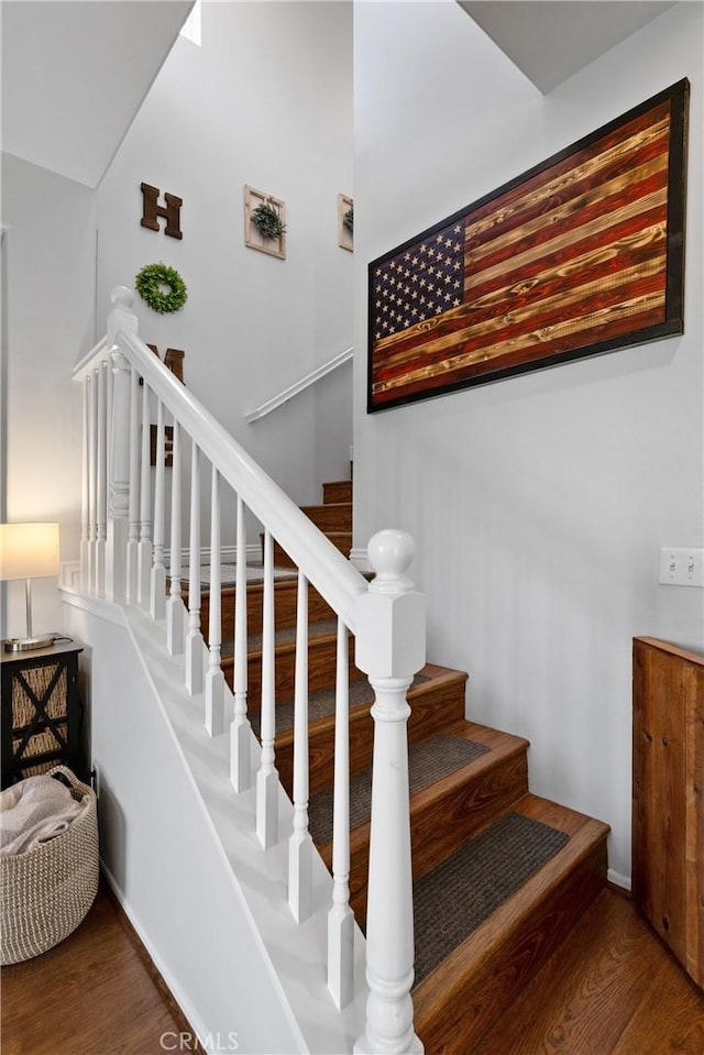 staircase featuring hardwood / wood-style floors