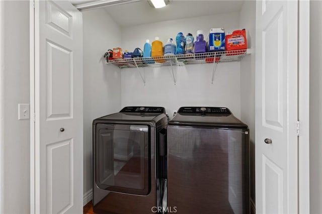 laundry area with washing machine and clothes dryer