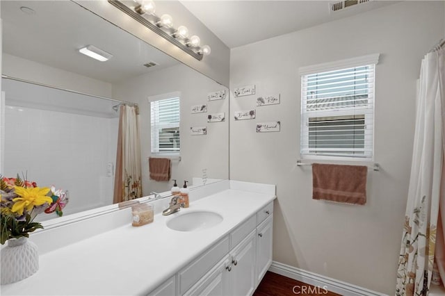 bathroom with vanity and a shower with curtain