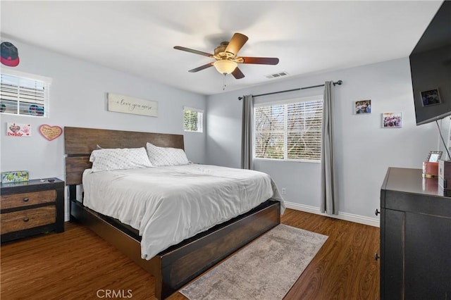 bedroom with dark wood-type flooring and ceiling fan