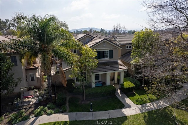 view of front of property featuring a mountain view and covered porch