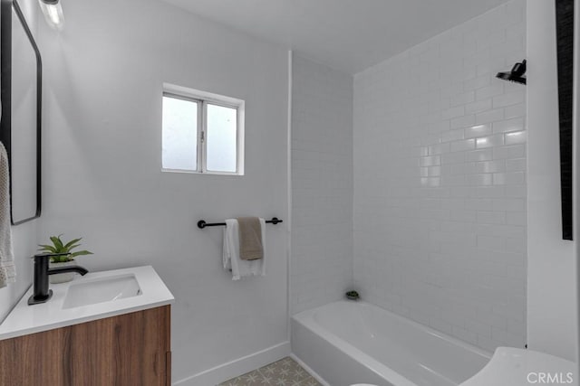 full bathroom featuring vanity, toilet, and tiled shower / bath