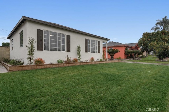 ranch-style house with a front lawn