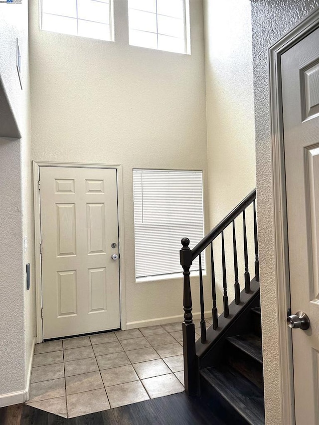 entryway featuring light tile patterned floors