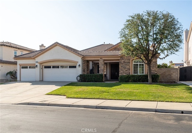 view of front of home with a garage and a front yard