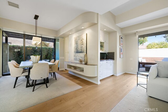 dining space featuring light hardwood / wood-style floors