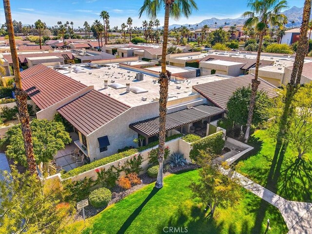 birds eye view of property featuring a mountain view