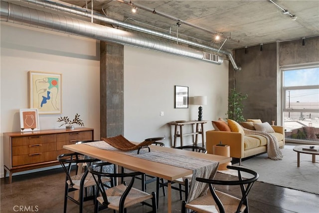 dining room with concrete floors