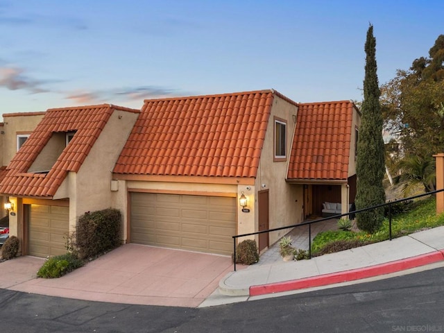 townhome / multi-family property featuring a garage