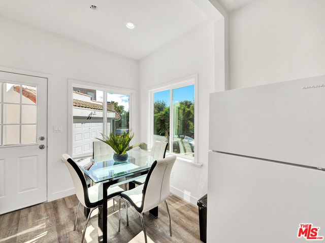 dining area with hardwood / wood-style flooring