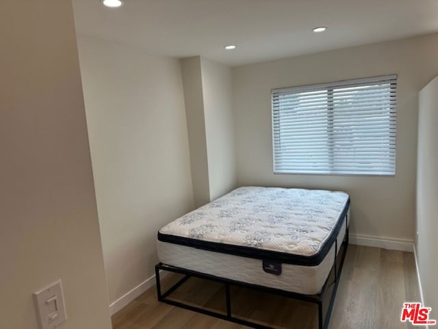 bedroom with light hardwood / wood-style flooring