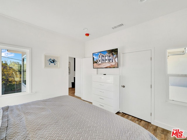 unfurnished bedroom featuring hardwood / wood-style floors