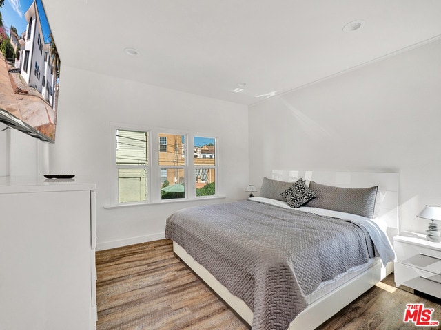 bedroom featuring hardwood / wood-style flooring