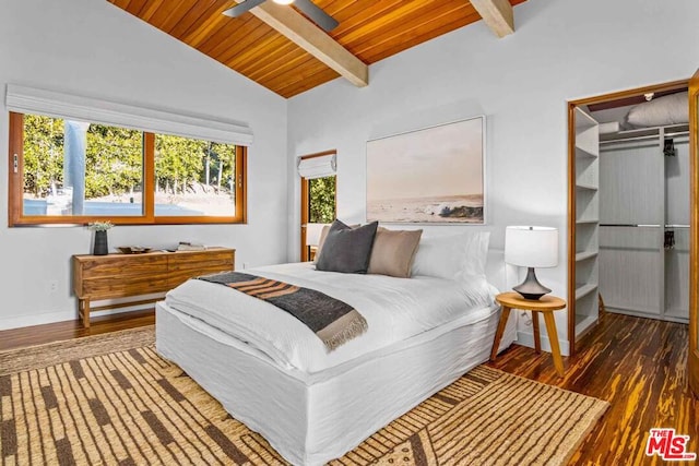 bedroom featuring multiple windows, dark hardwood / wood-style flooring, and lofted ceiling with beams