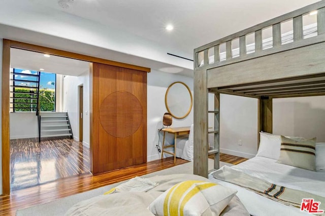 bedroom featuring hardwood / wood-style floors