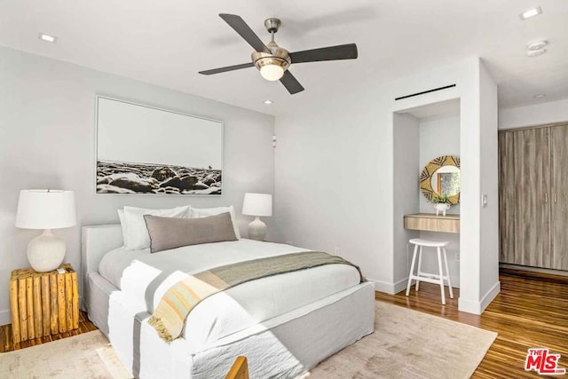 bedroom featuring wood-type flooring and ceiling fan