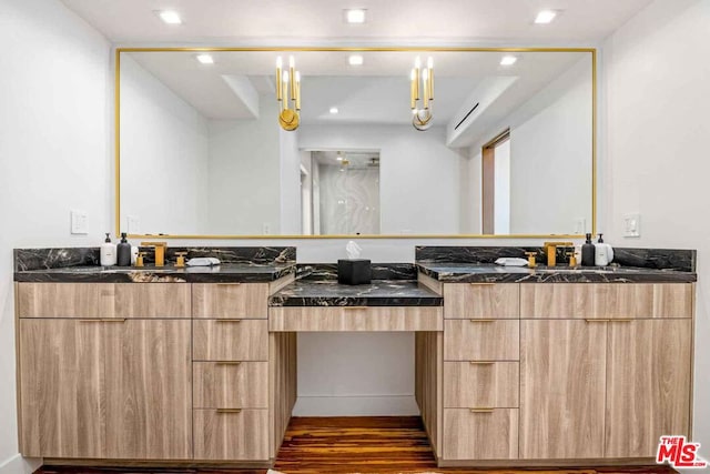 bathroom featuring hardwood / wood-style flooring and vanity